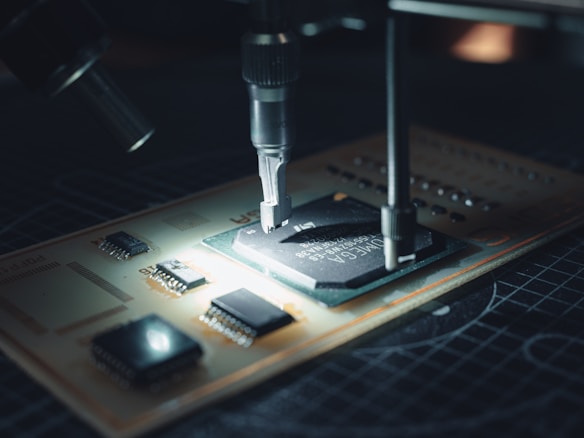 Semiconductor chip under a test probe in a hardware lab