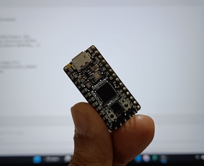 Engineer holding a compact development board