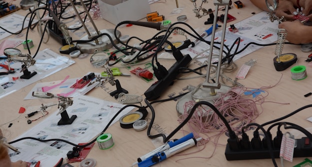 Electronics workshop bench with soldering stations